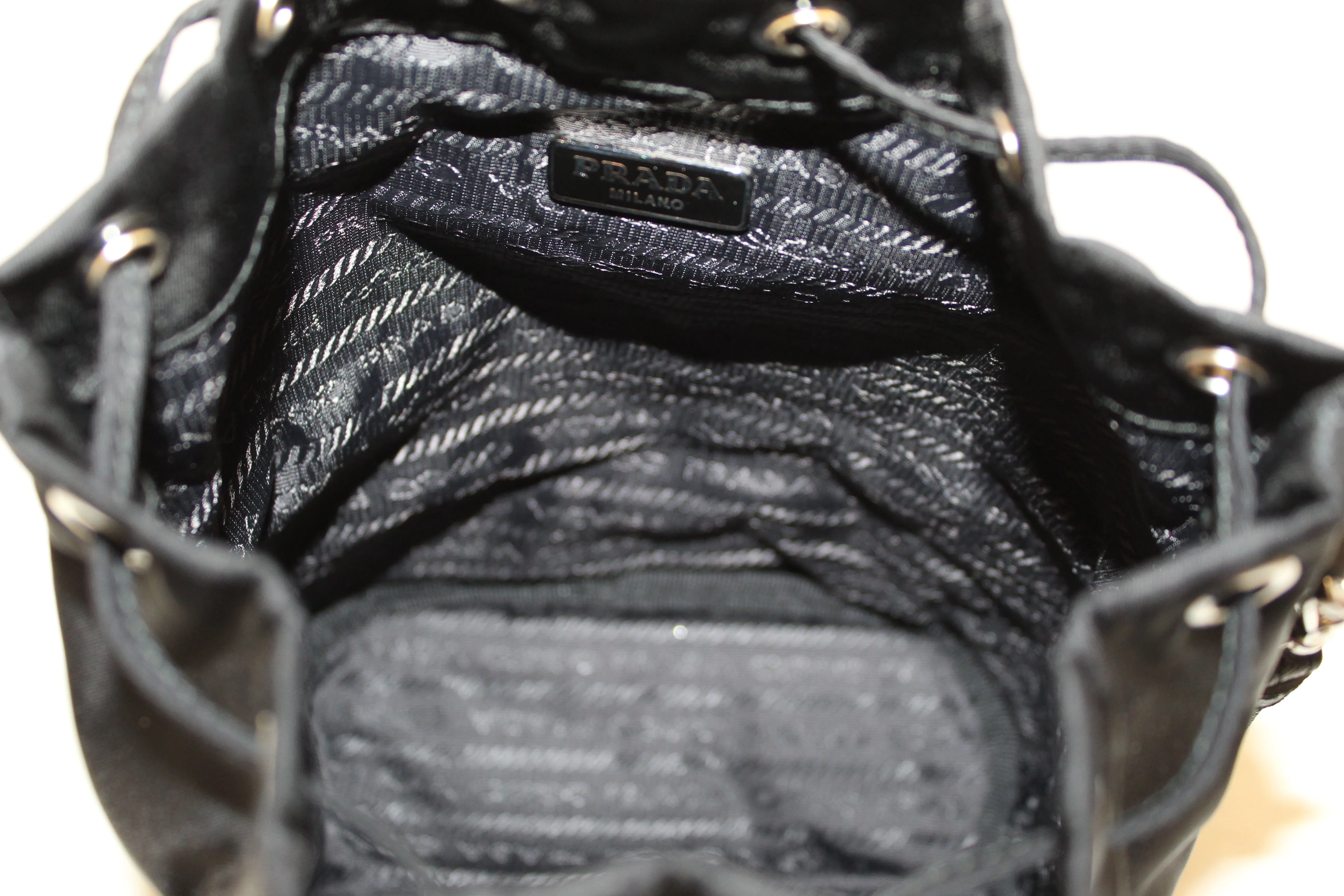 Authentic New Prada Black Nylon Drawstring Wristlet Pouch with Metal Appliques